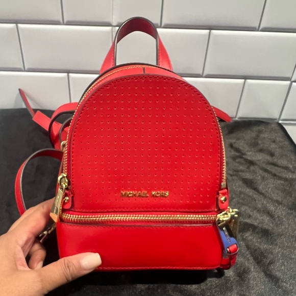 MICHAEL KORS red mini backpack used​